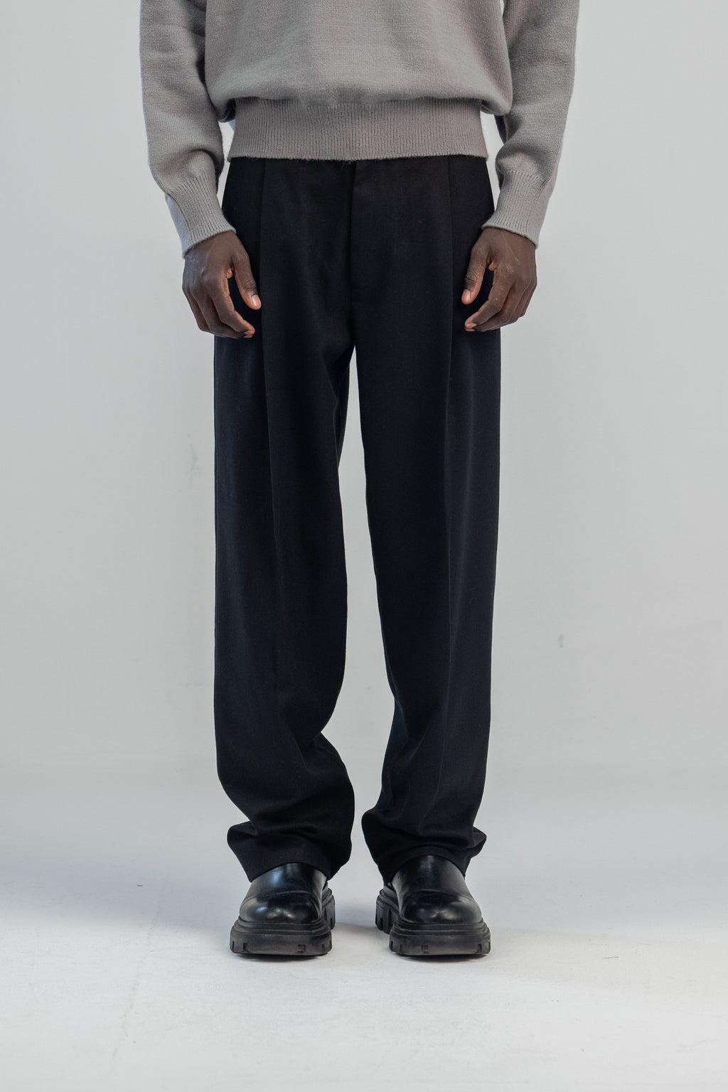 Black wool wide leg pleated trousers