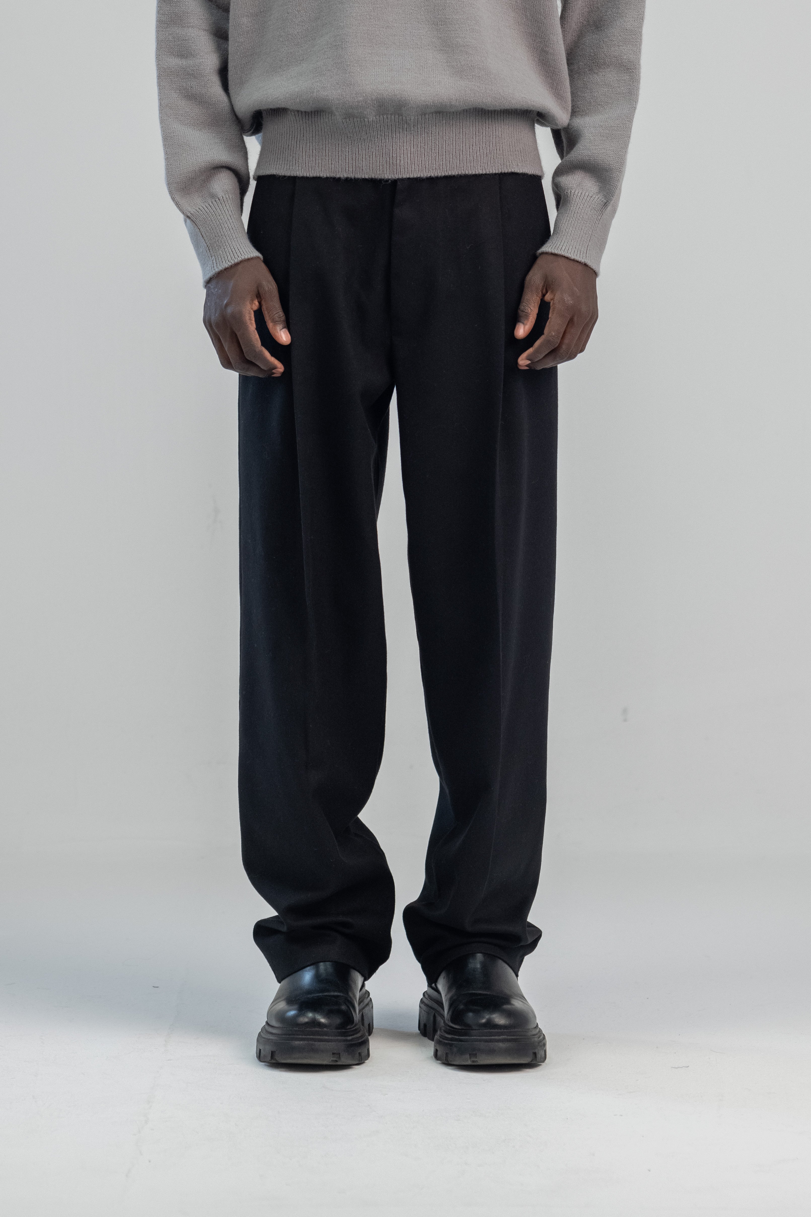 Black wool wide leg pleated trousers