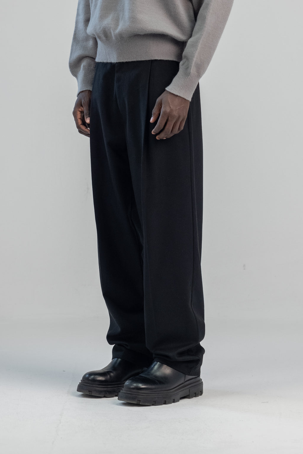 Black wool wide leg pleated trousers