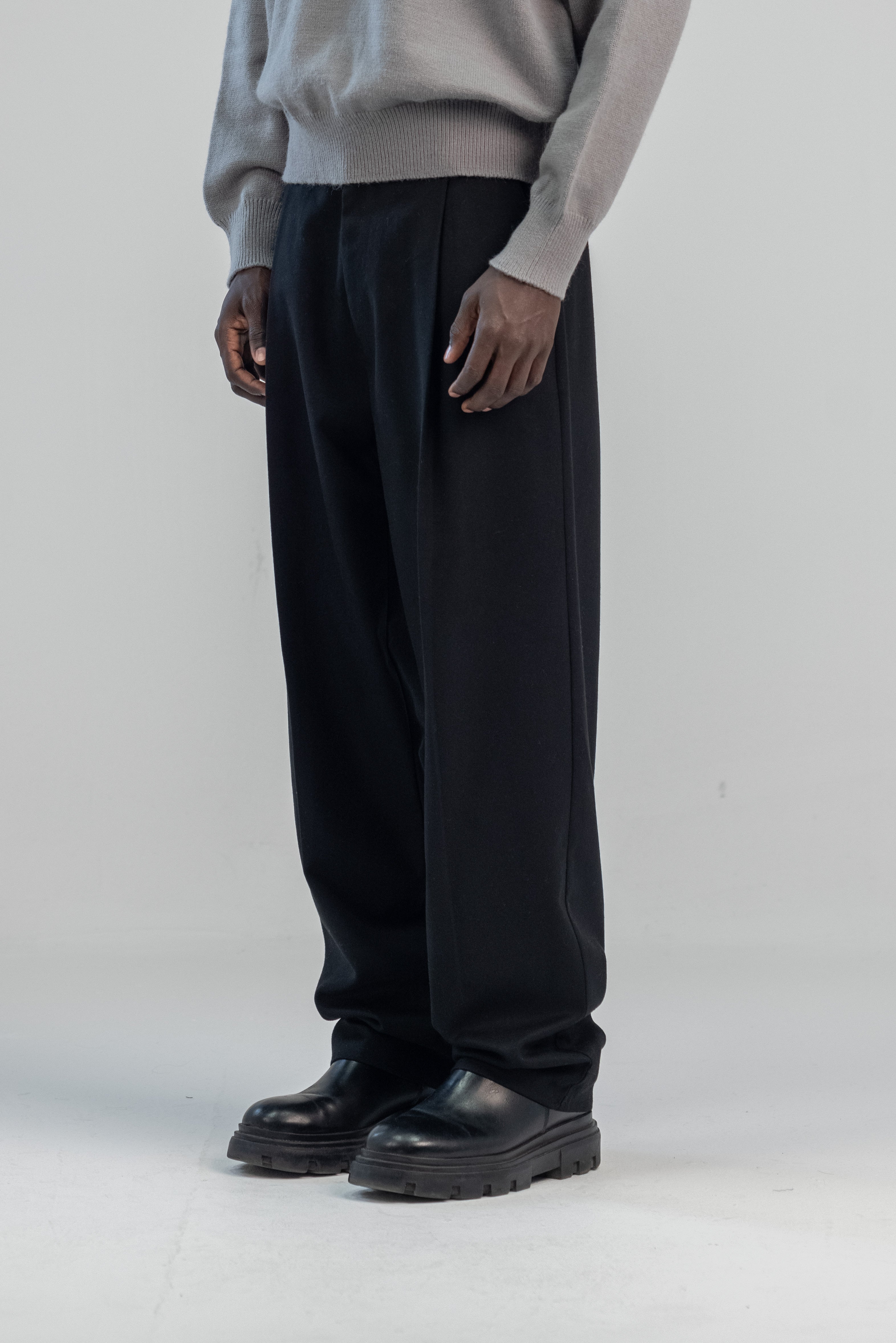 Black wool wide leg pleated trousers