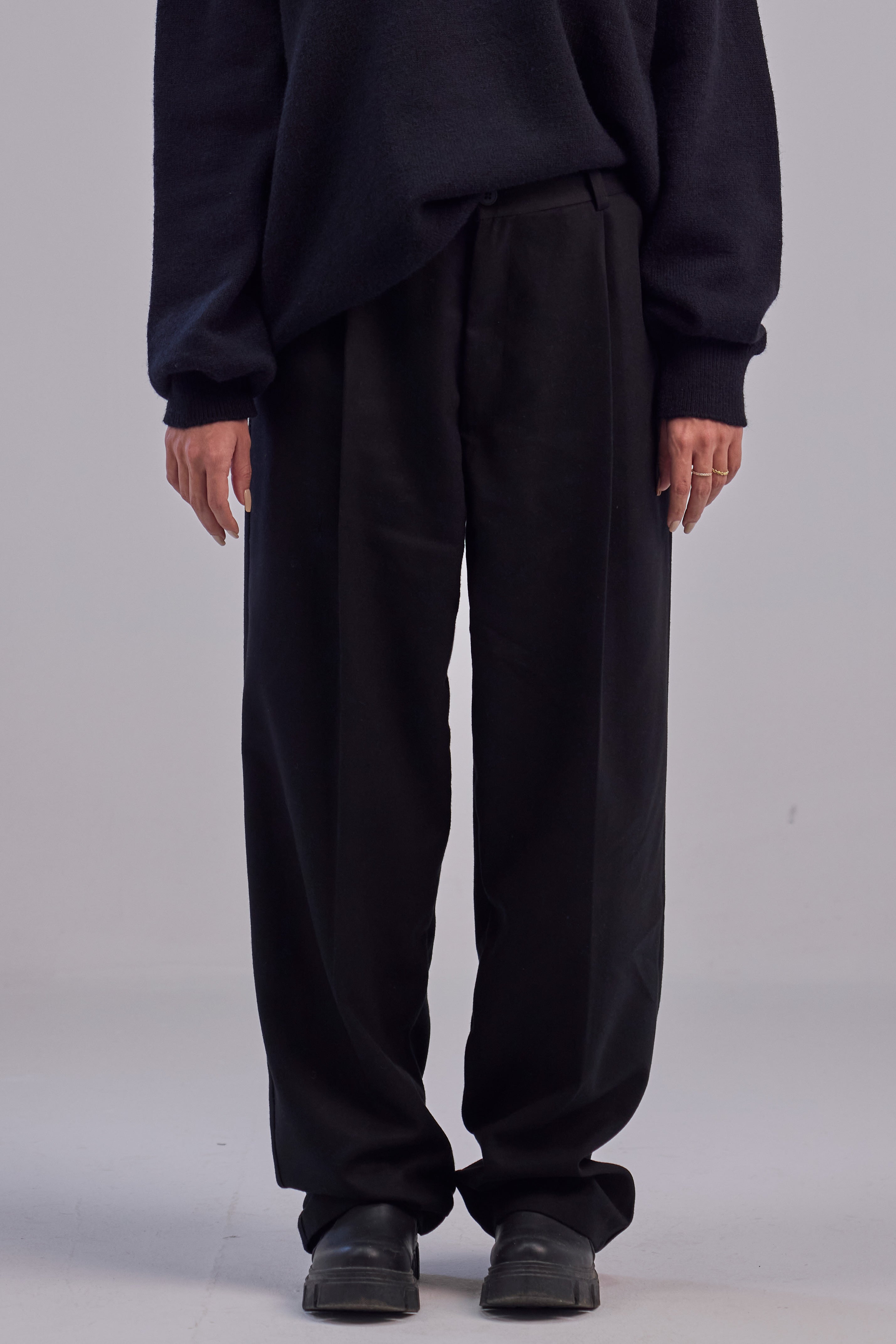 Black wool wide leg pleated trousers
