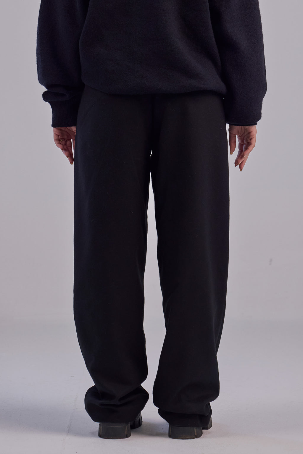 Black wool wide leg pleated trousers